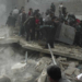 Syrians from a neighborhood in the northern city of Aleppo search for survivors under the rubble of a collapsed building on March 5, 2014, after a barrel bomb was reportedly dropped by Syrian government forces. Syrian government forces are waging a campaign of siege warfare and starvation against civilians as part of its military strategy, a UN-mandated probe said. The commission, which includes legendary former war crimes prosecutor Carla del Ponte, stressed that more than 250,000 people remain besieged in war-ravaged country. AFP PHOTO/BARAA AL-HALABI (Photo by BARAA AL-HALABI / AFP)