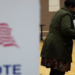 A woman votes at a voting site as Democrats and Republicans hold their Michigan primary presidential election, in Detroit, Michigan, U.S. February 27, 2024. REUTERS/Dieu-Nalio Chery