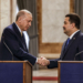 Iraq's Prime Minister Mohammed Shia al-Sudani (R) and Turkey's President Recep Tayyip Erdogan shake hands after a joint statement to the media in Baghdad on April 22, 2024. (Photo by Thaier Al-Sudani / POOL / AFP)