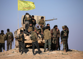 Members of Syrian Democratic Forces (SDF) stand together near Baghouz, Deir Al Zor province, Syria February 12, 2019. Picture taken February 12, 2019. REUTERS/ Rodi Said