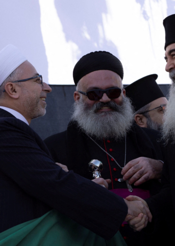 Religious leaders of Latakia address people as they celebrate after ousting of Syria's Bashar al-Assad, during a gathering after Friday prayers in Latakia, Syria, December 13, 2024. REUTERS/Umit Bektas